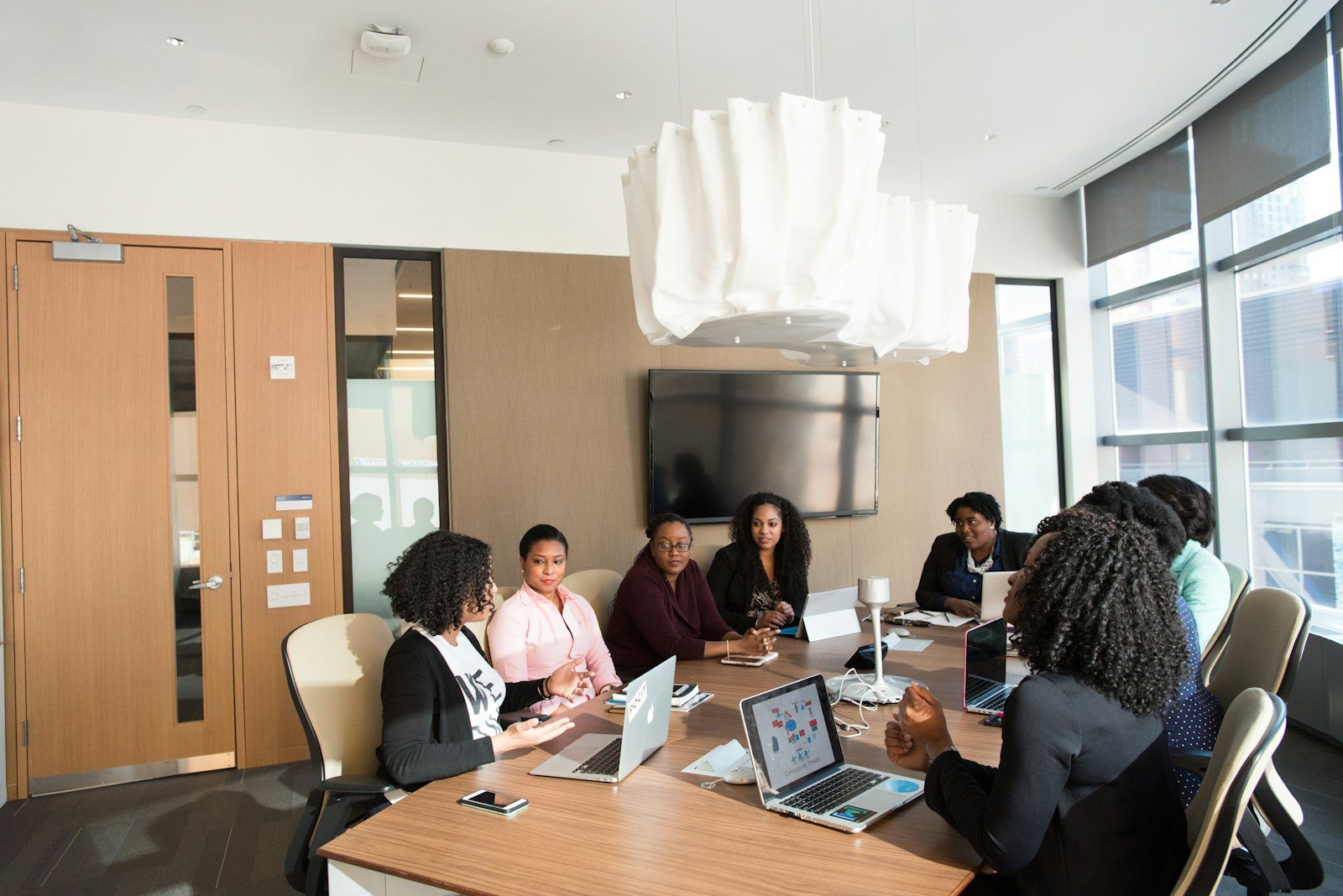 Colleagues talking together in a bright office